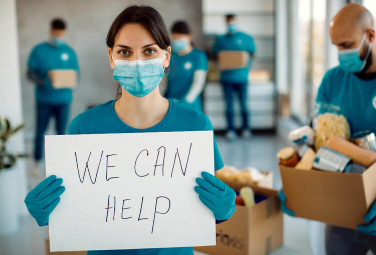 young-woman-working-as-volunteer-holding-placard-with-we-can-help-inscription (1)young-woman-working-as-volunteer-holding-placard-with-we-can-help-inscription (1)